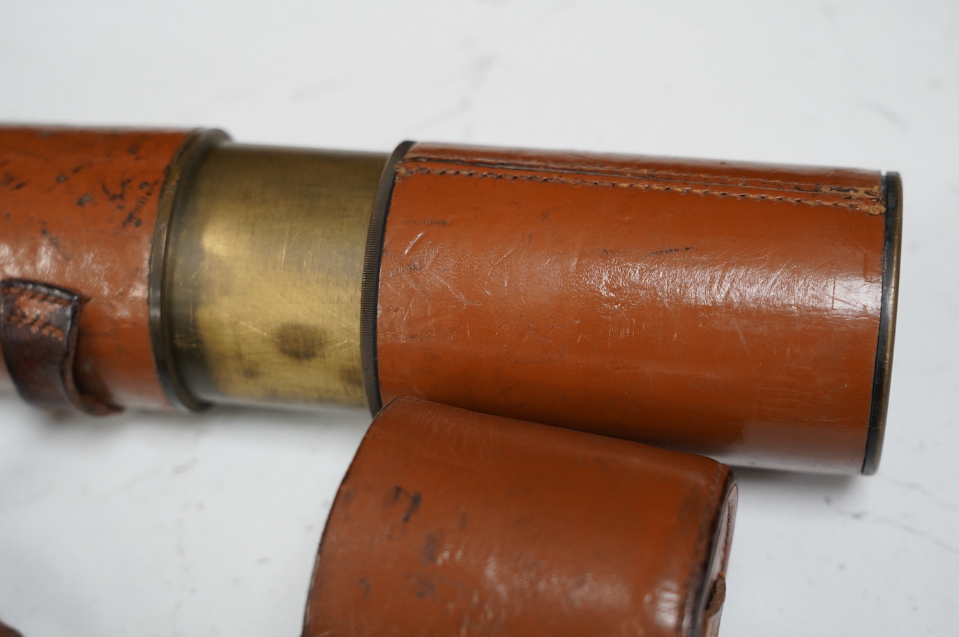 A brass three draw military telescope, marked “ABL 1950 Tel. Sgn. Mk VI. V6-OS 717 GA No 049”. Condition - fair to good, a little worn, good optics